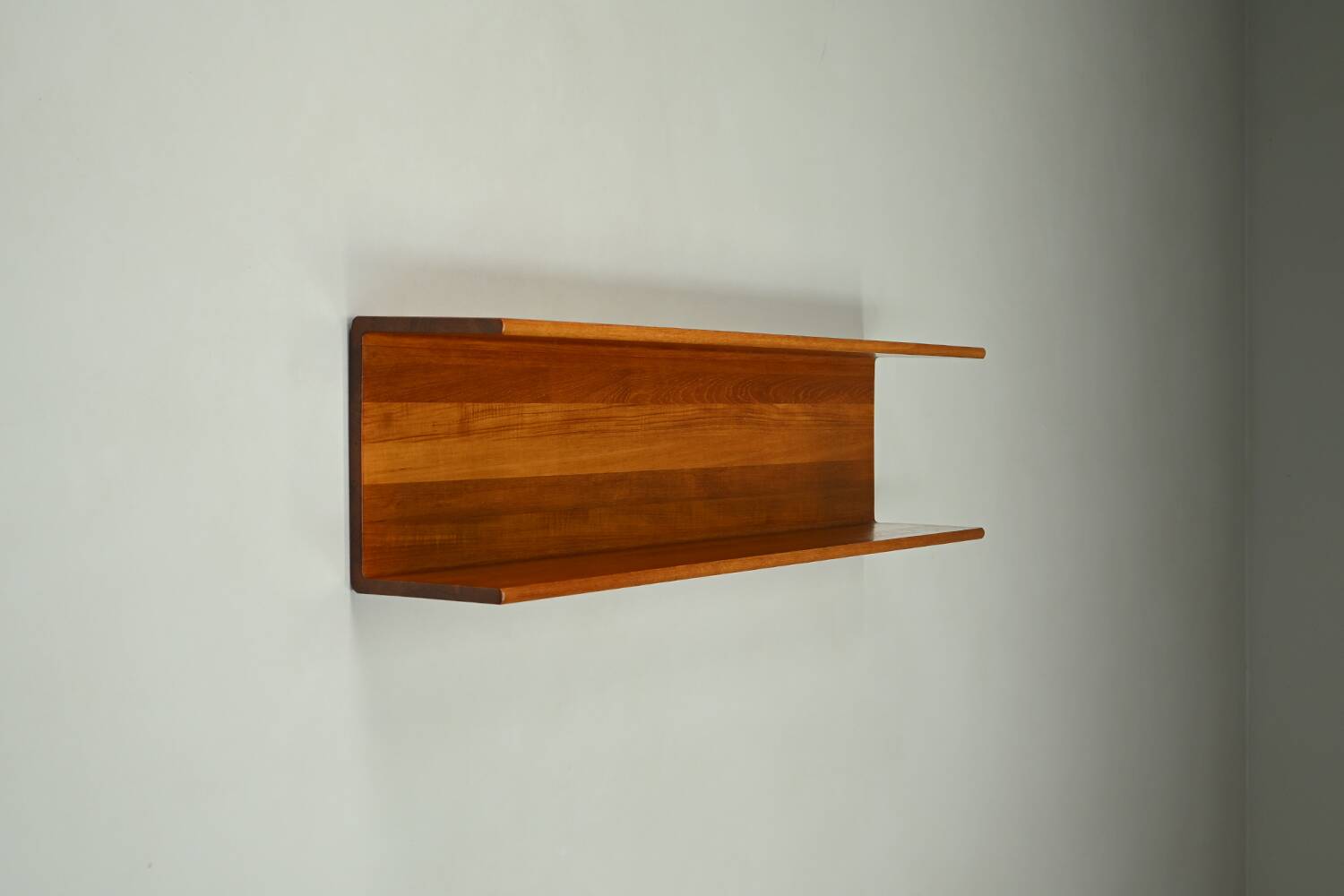 Solid teak wall shelf, 1960s Germany.