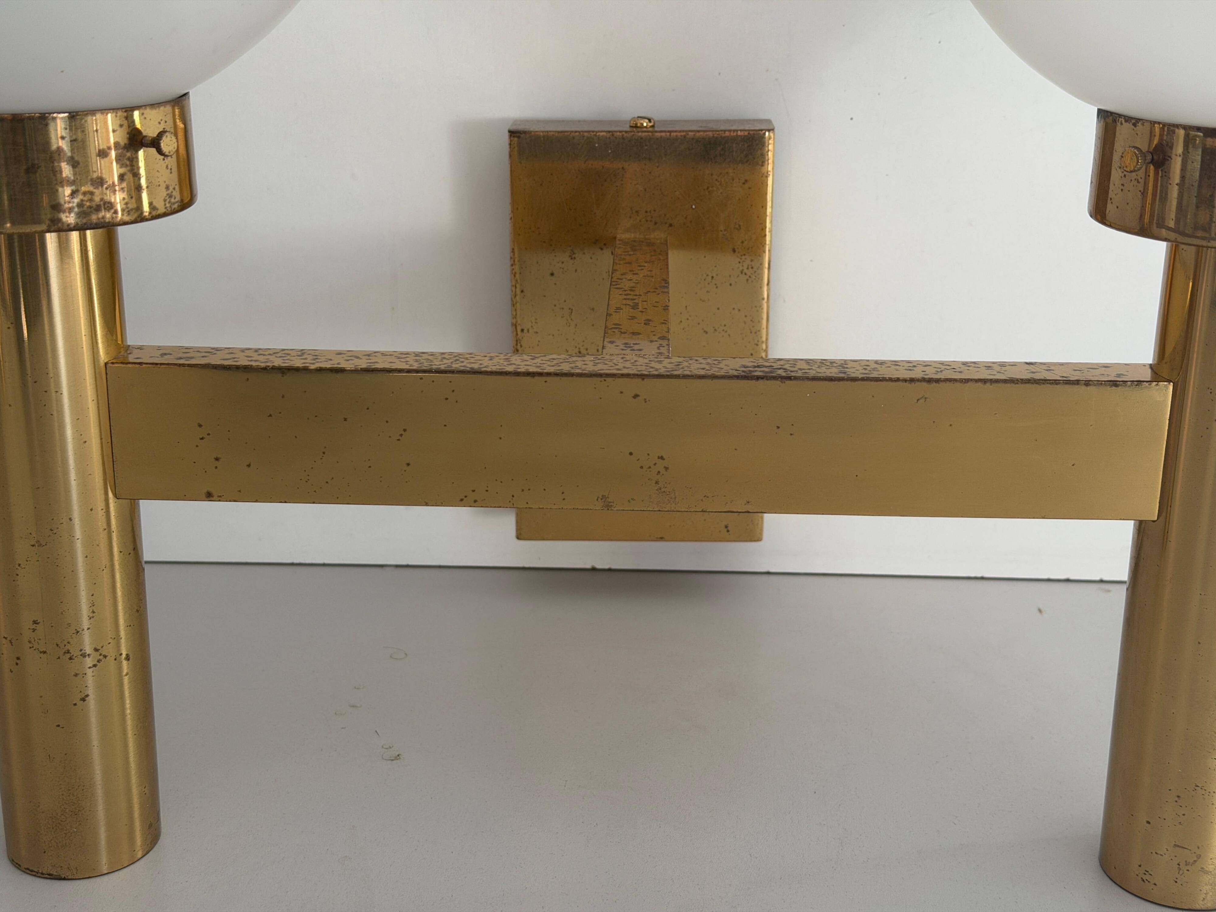 Double opal glass and heavy brass, large minimalist cinema wall light, 1960s, Germany