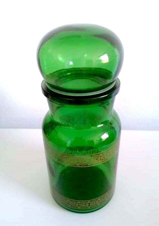 Apothecary jar in vintage green and gold glass