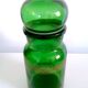 Apothecary jar in vintage green and gold glass