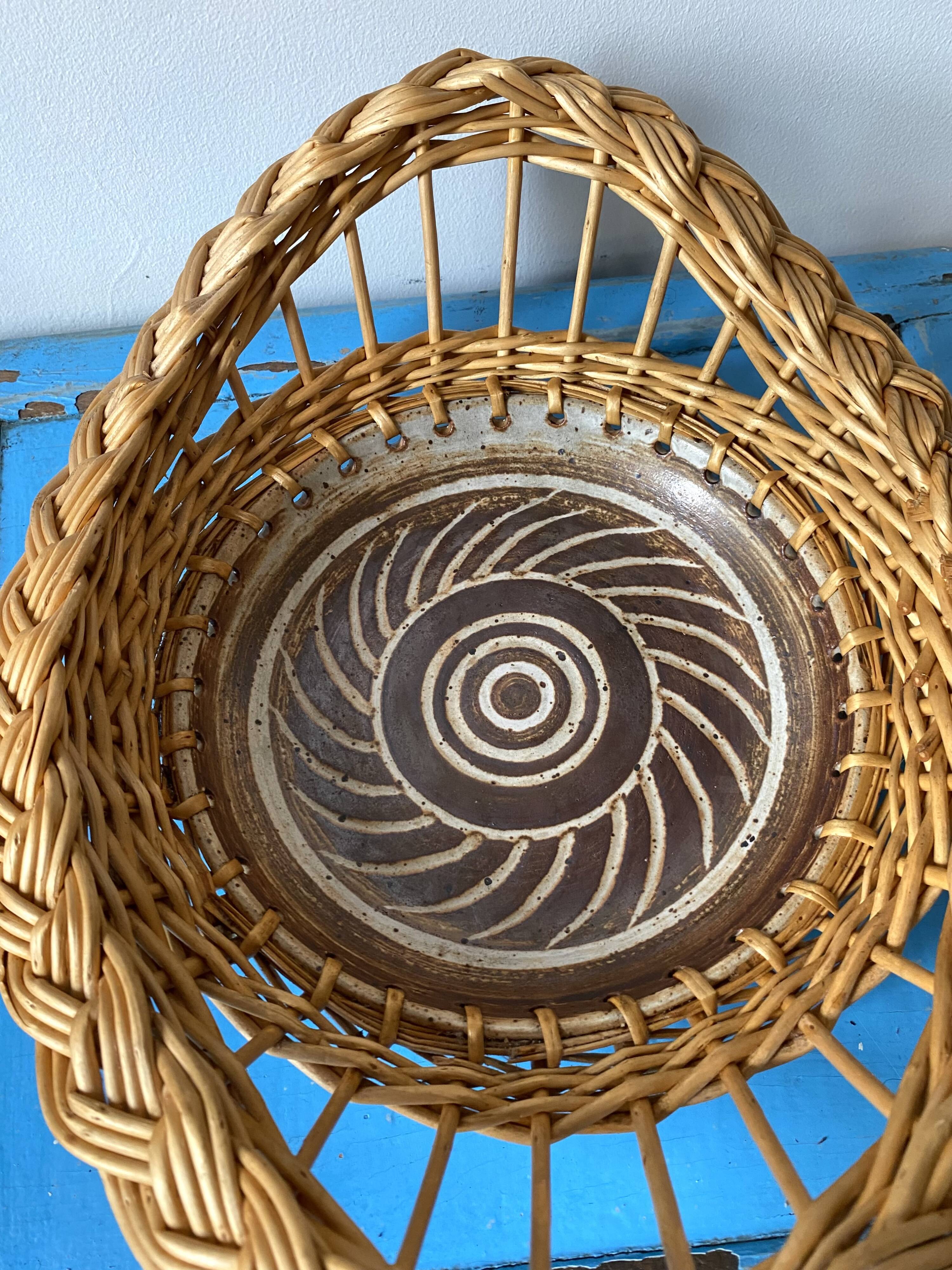 Wicker and ceramic piece signed, 1990s.