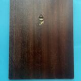 Faceted modernist wall mirror in steel and brass, geometric mixed metal frame 1970s.