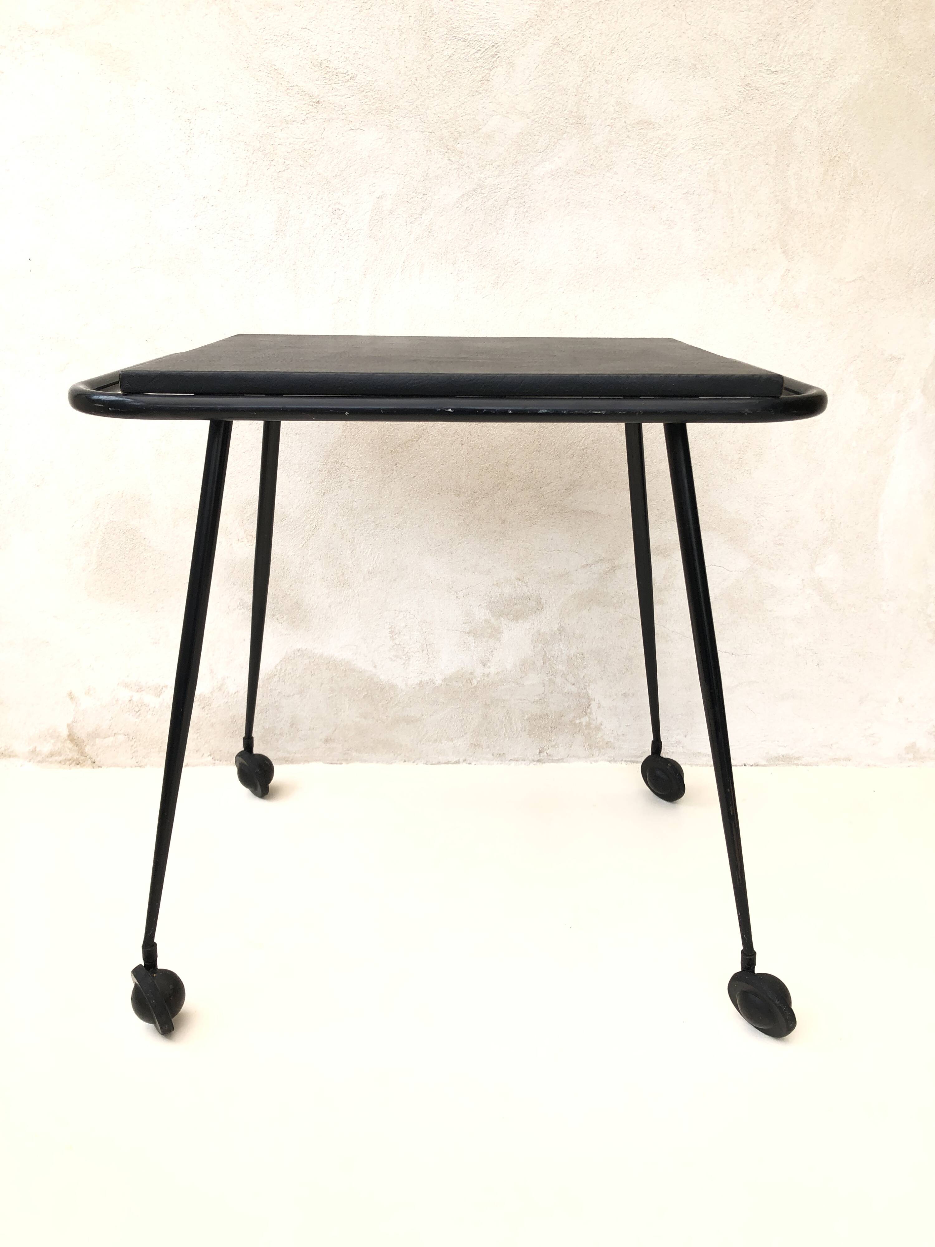 Black table on wheels from the 60s