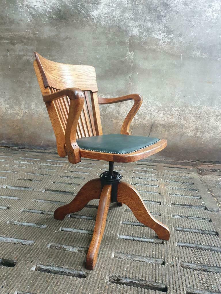 Antique office chair oak adjustable with green leather