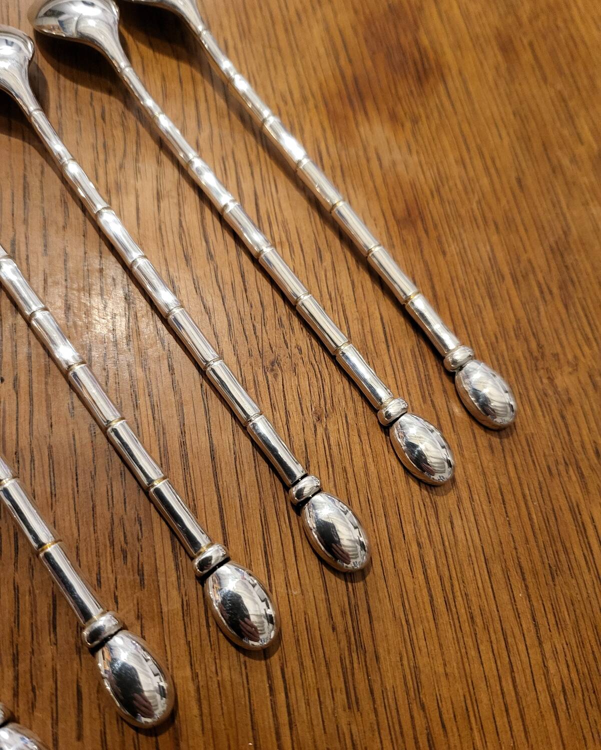 6 long silver-plated metal spoons