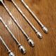 6 long silver-plated metal spoons