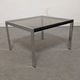 Bedside table or end of sofa in chromed metal and smoked glass from the 70s