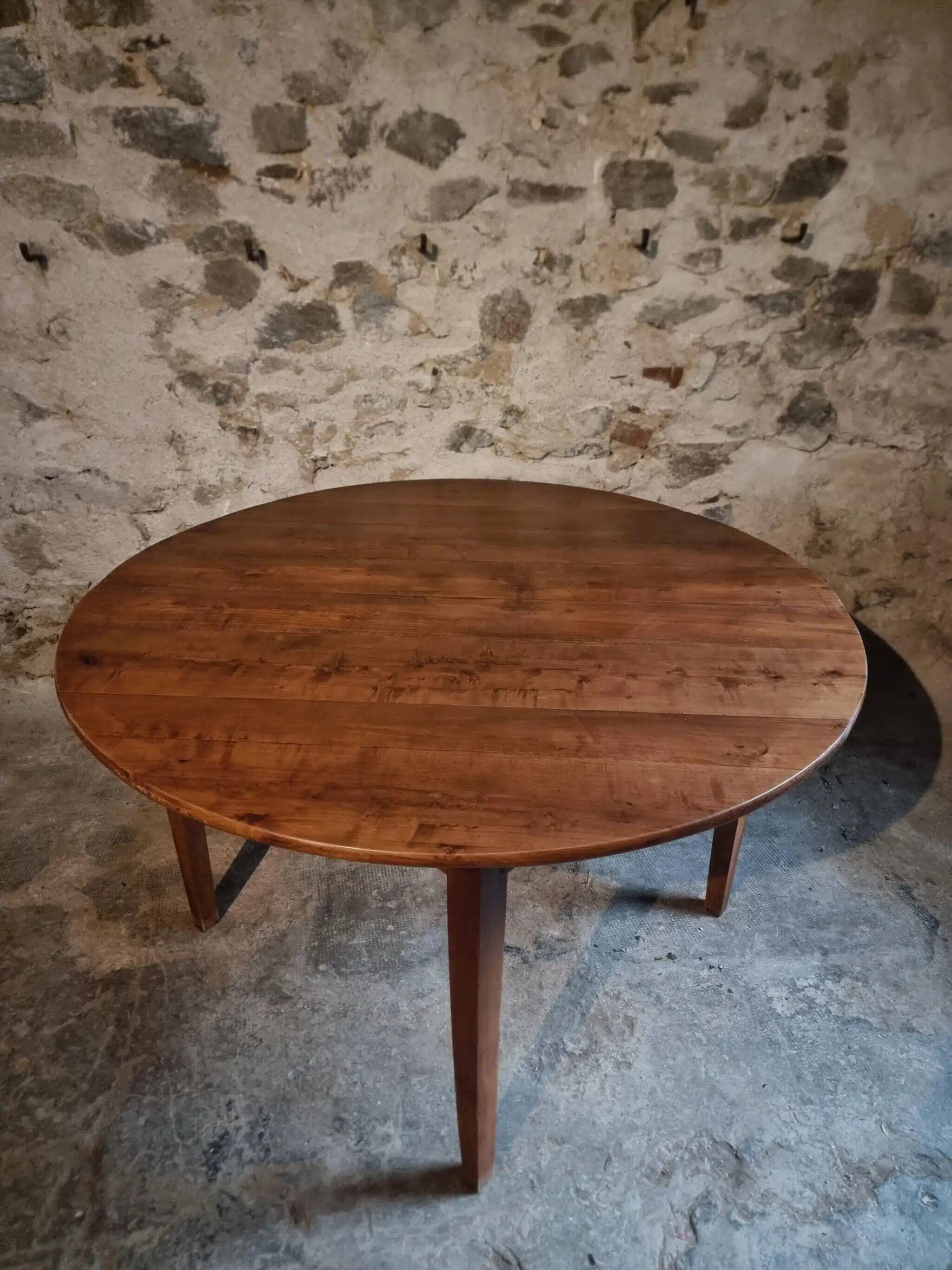 Antique round dining table in cherry wood, France, circa 1920.