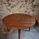 Antique round dining table in cherry wood, France, circa 1920.
