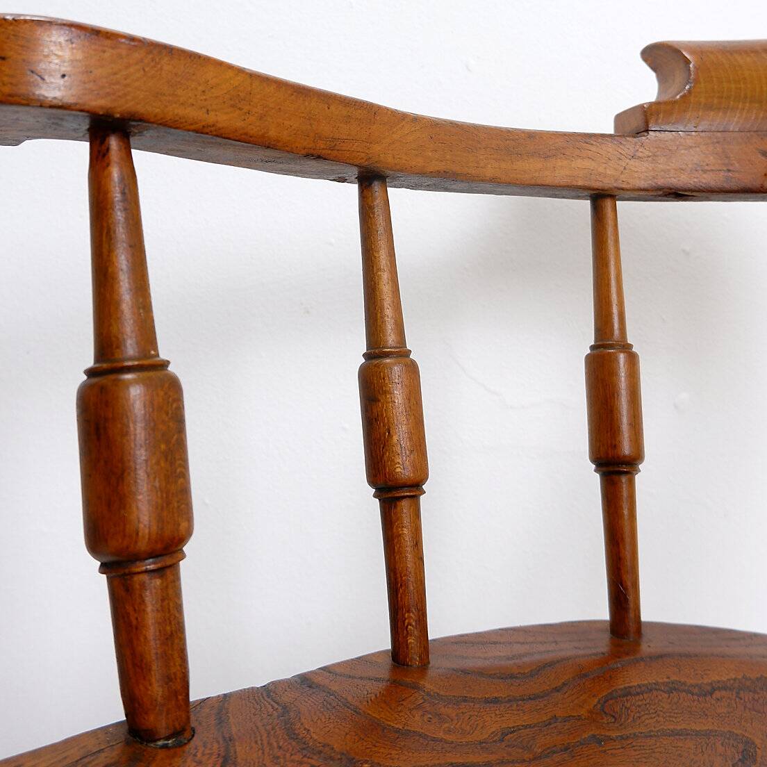 Elm armchair with curved back