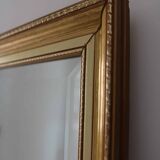 Large beveled mirror in carved wood