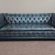 Chesterfield sofa buttoned in blue cowhide, 2.5 seats
