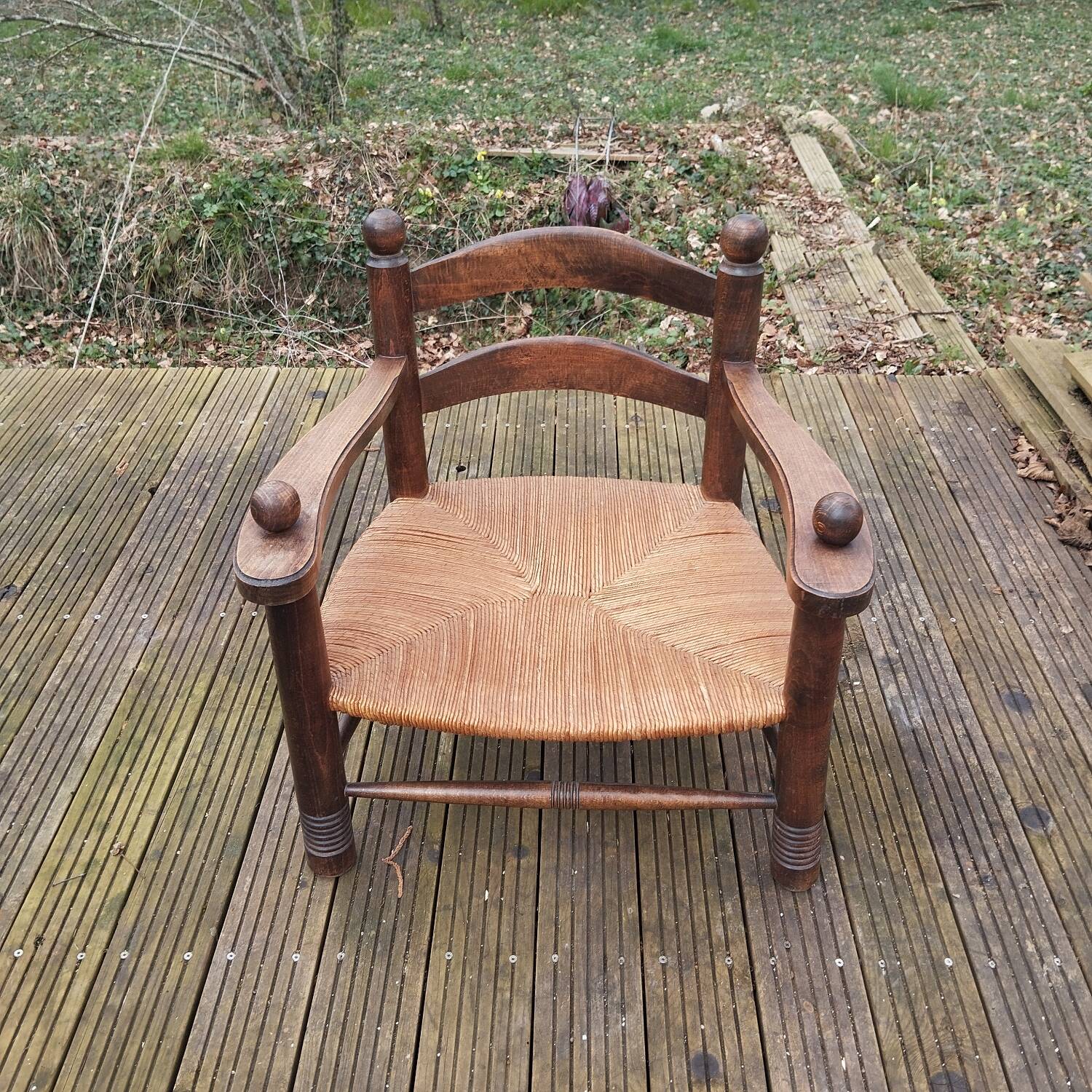 Low straw fireplace armchair in Dudouyt style