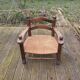 Low straw fireplace armchair in Dudouyt style