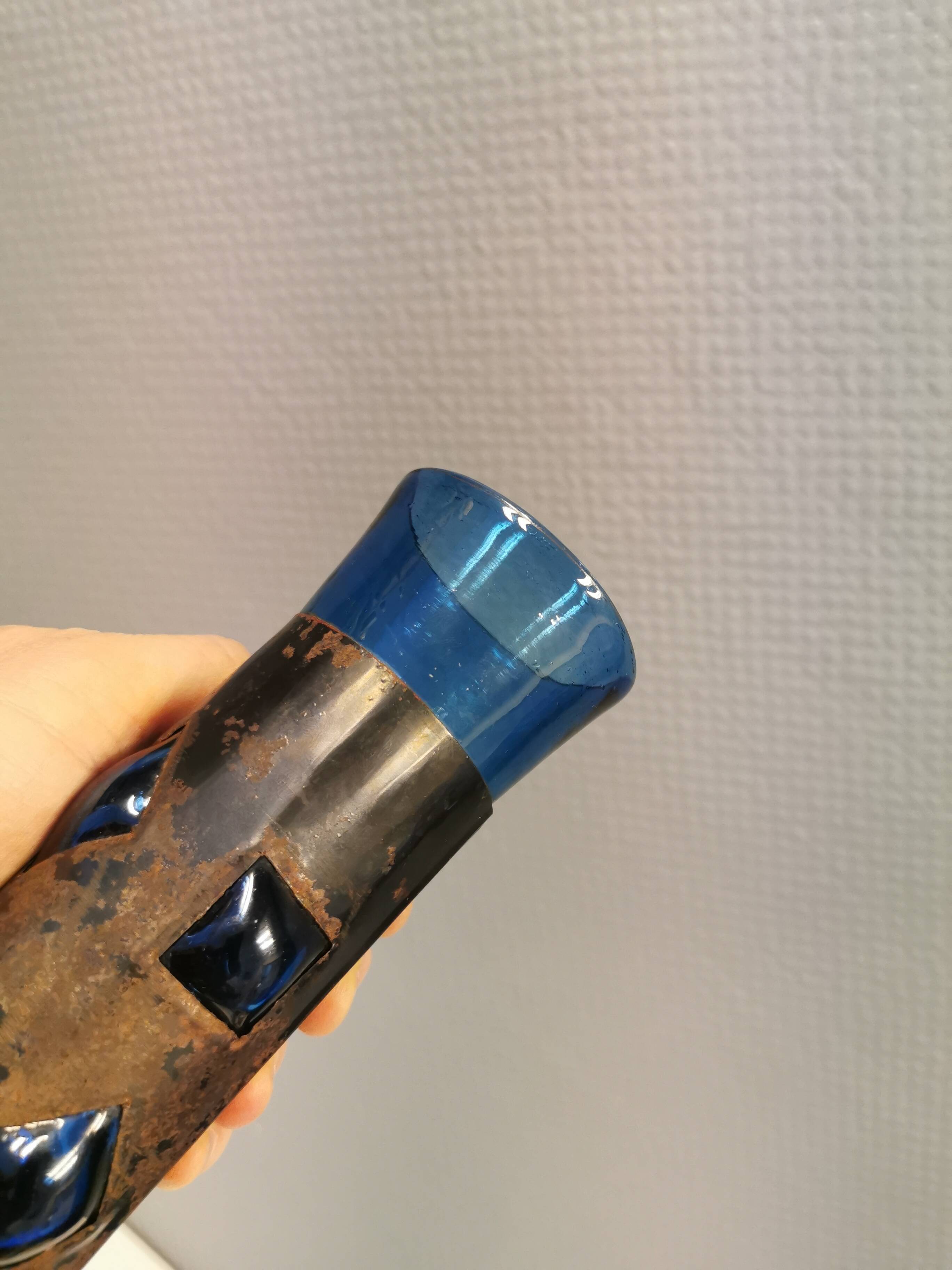 Brutalist style vase with inner blue glass mouth-blown out through the metal "frame".