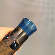 Brutalist style vase with inner blue glass mouth-blown out through the metal "frame".