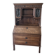 Large secretary with a drop-down front in carved oak, neo-Renaissance style.