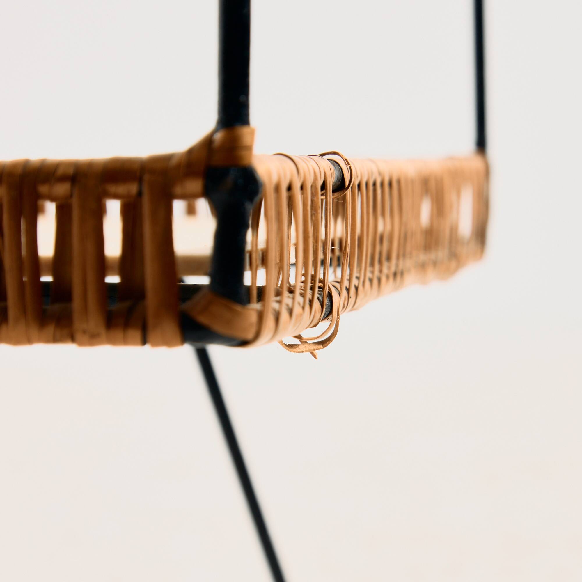 Metal cart with bamboo and wicker details.