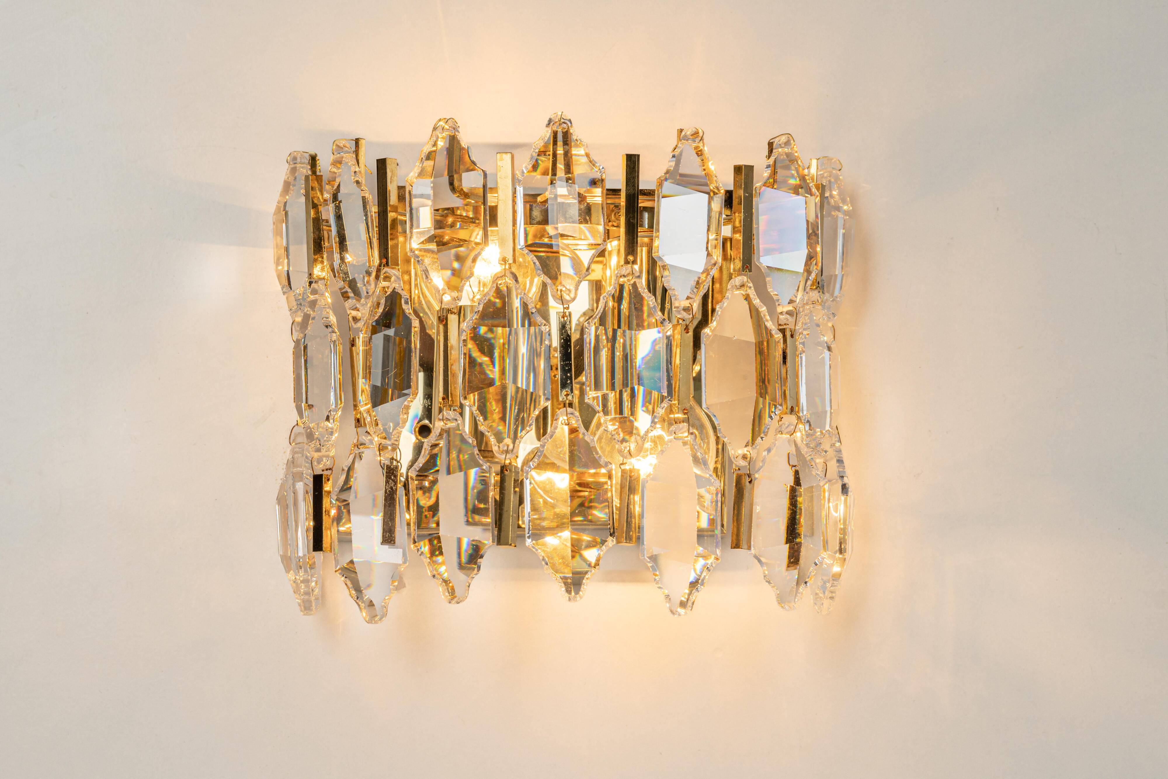 Pair of wall sconces in gilded brass and crystal by Palwa, Germany, 1970s.