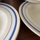 Set of 6 vintage deep plates in earthenware with blue lily of the valley flowers.