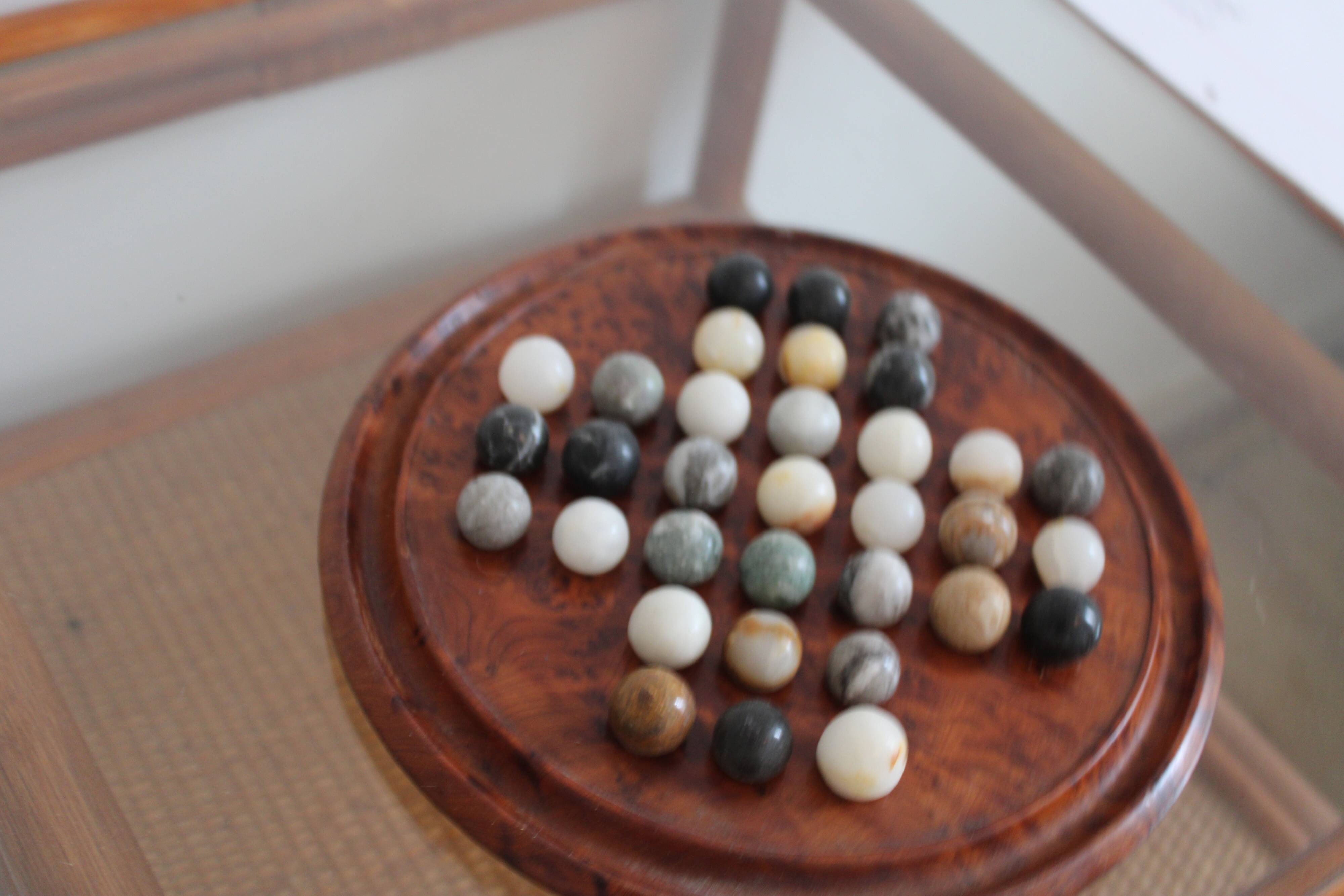 Solitaire game or mineral abacus