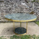 Round dining table with green marble and solid brass.