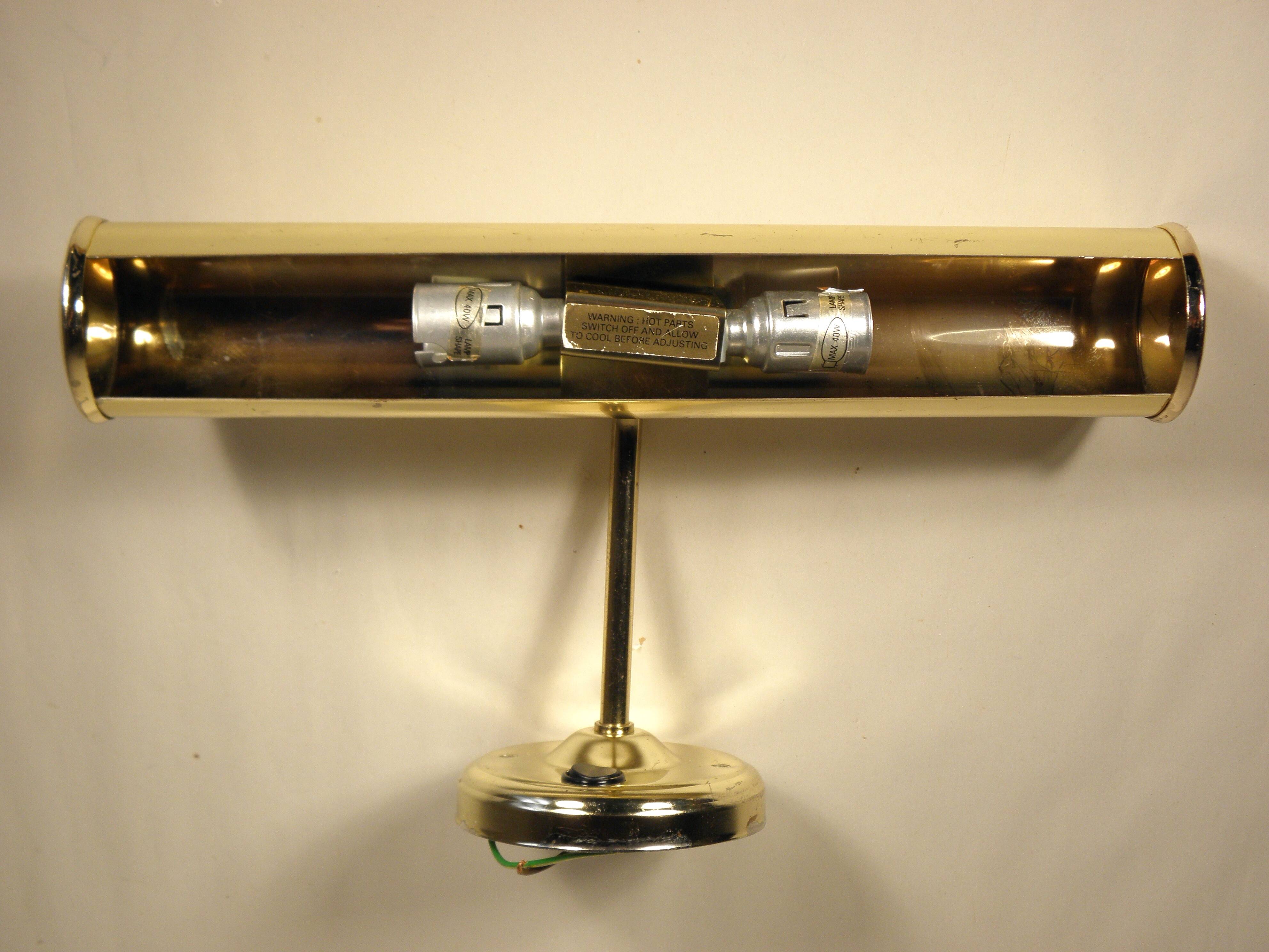 Two gold metal picture sconces