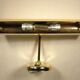 Two gold metal picture sconces
