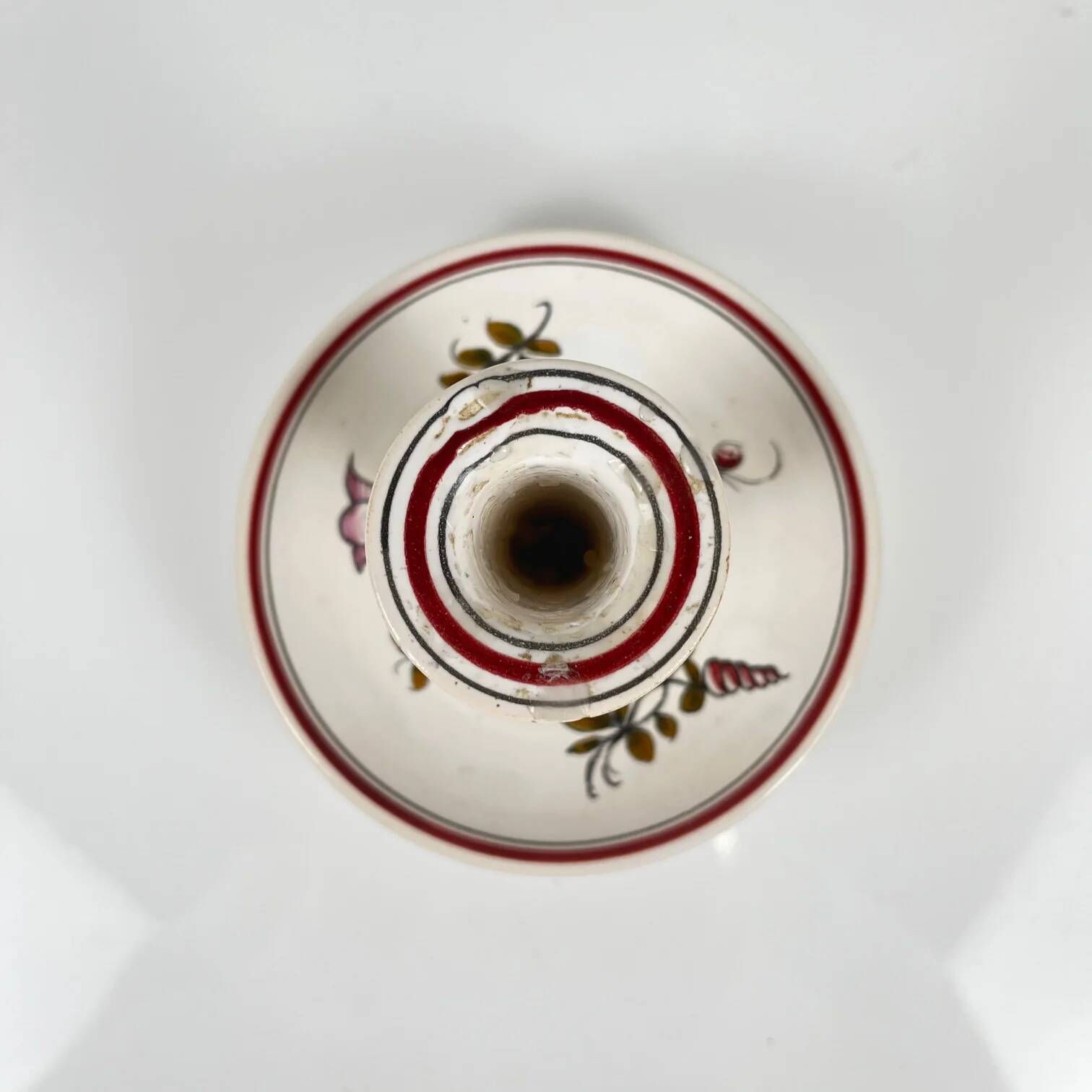 Hand-painted ceramic candlestick, flower pattern.