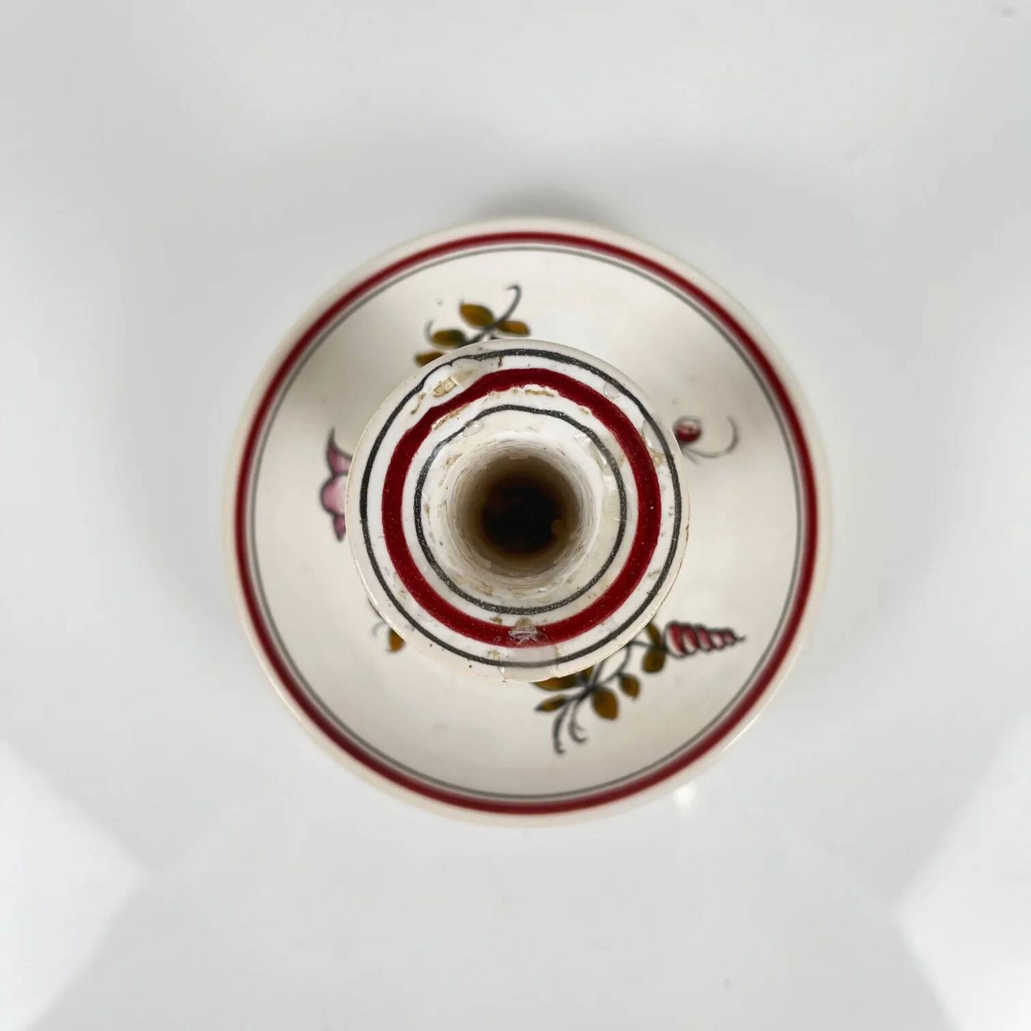 Hand-painted ceramic candlestick, flower pattern.