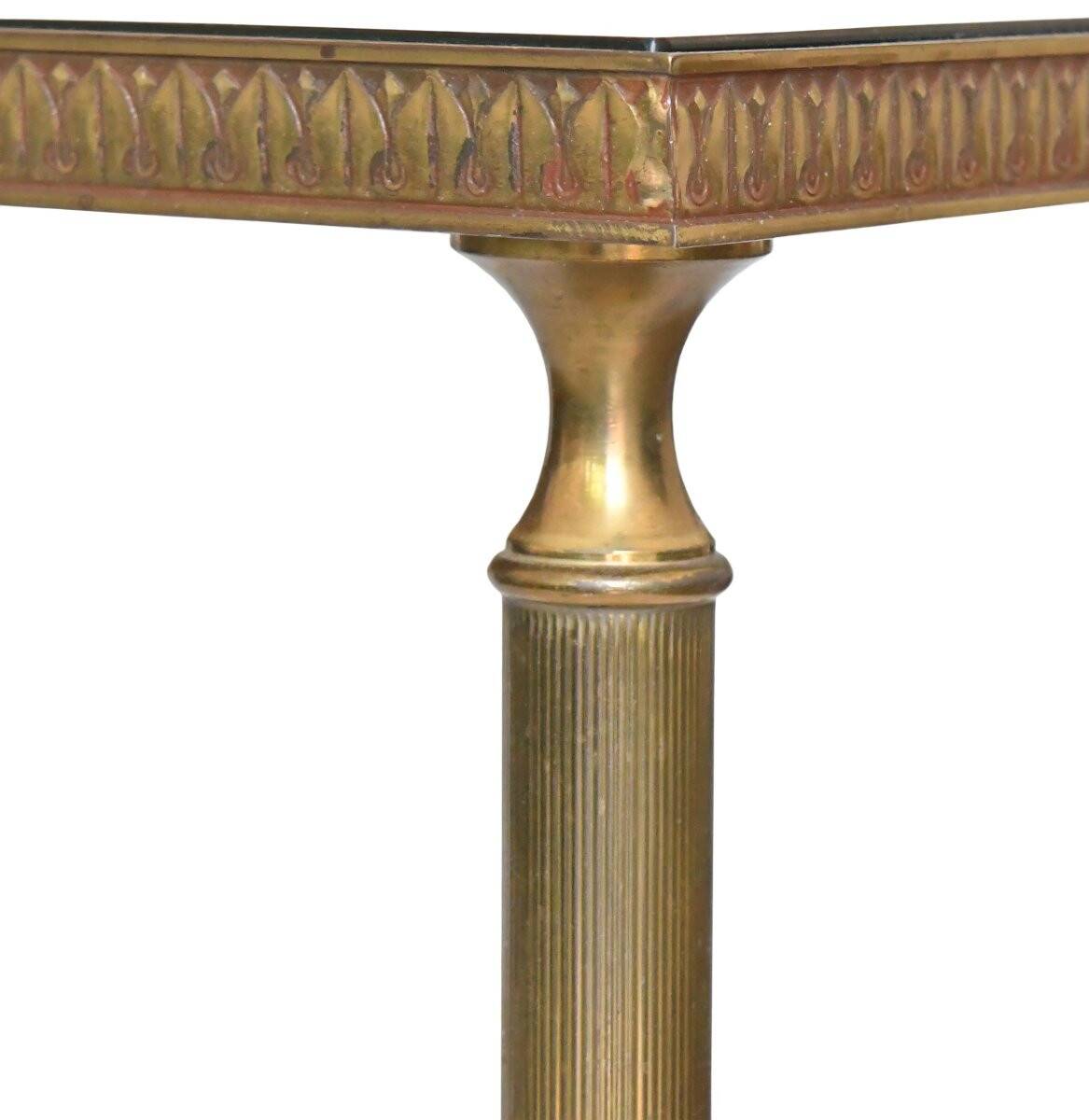 Coffee table in gilded brass with a mirrored eglomisé glass top.