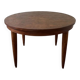 Oval extendable dining table in wood and walnut burl veneer.