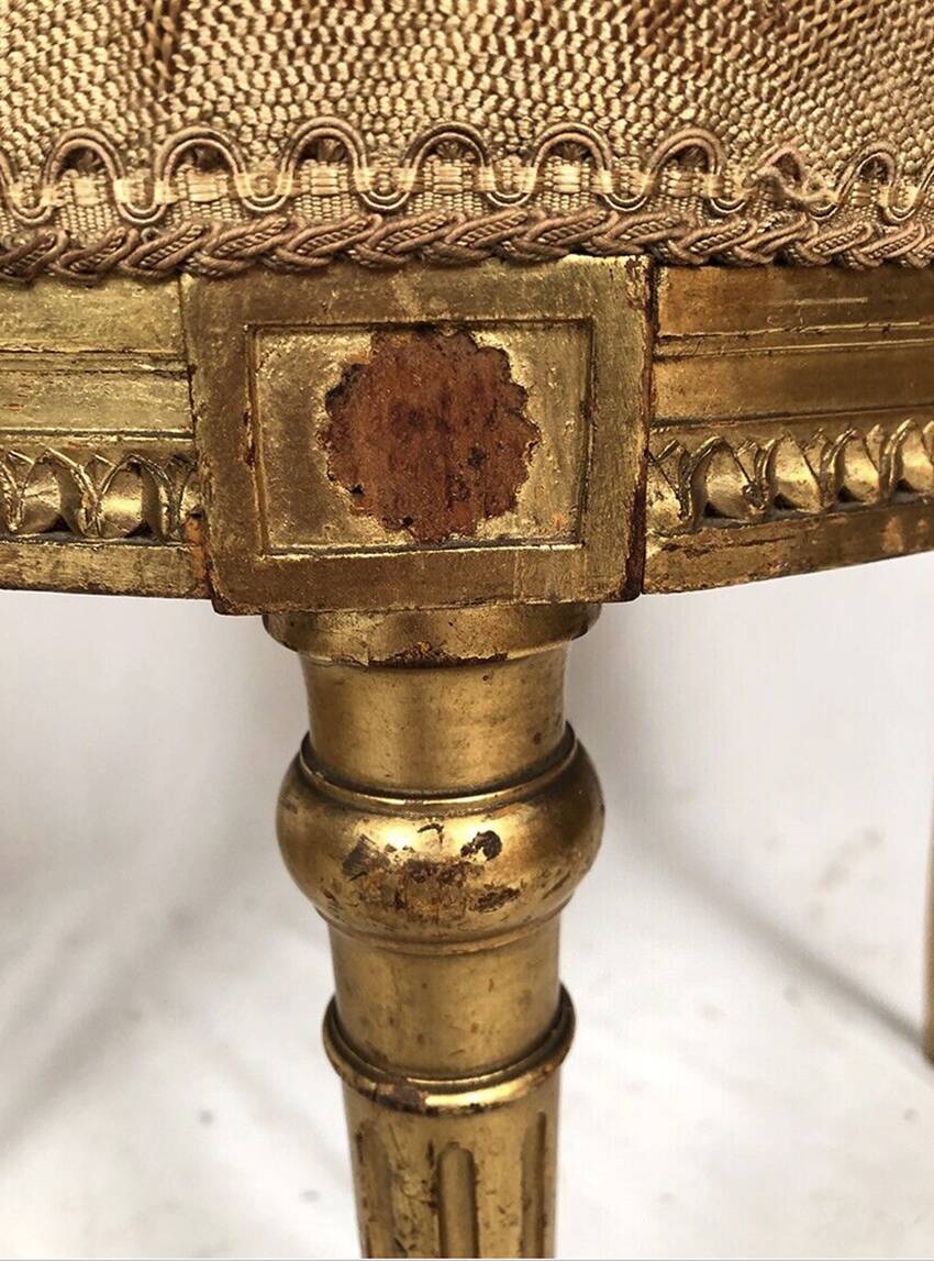 Series of three Louis XVI style chairs in gilded wood, circa 1900