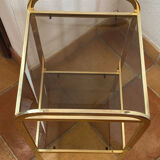 Gold metal and smoked glass console table.
