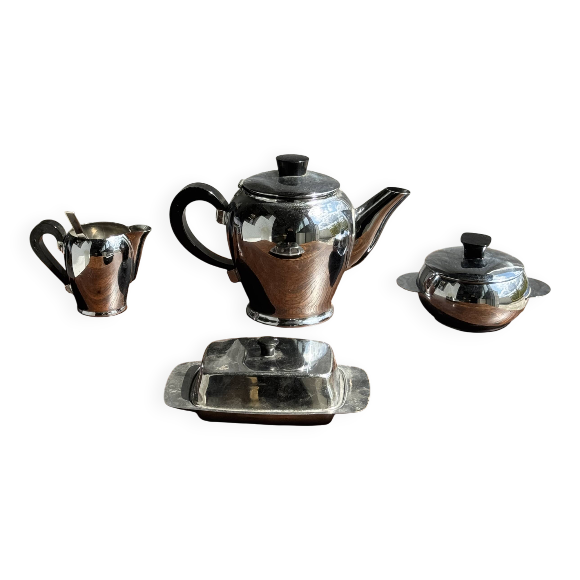 Tea set including teapot, milk jug, sugar bowl and butter dish