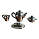 Tea set including teapot, milk jug, sugar bowl and butter dish