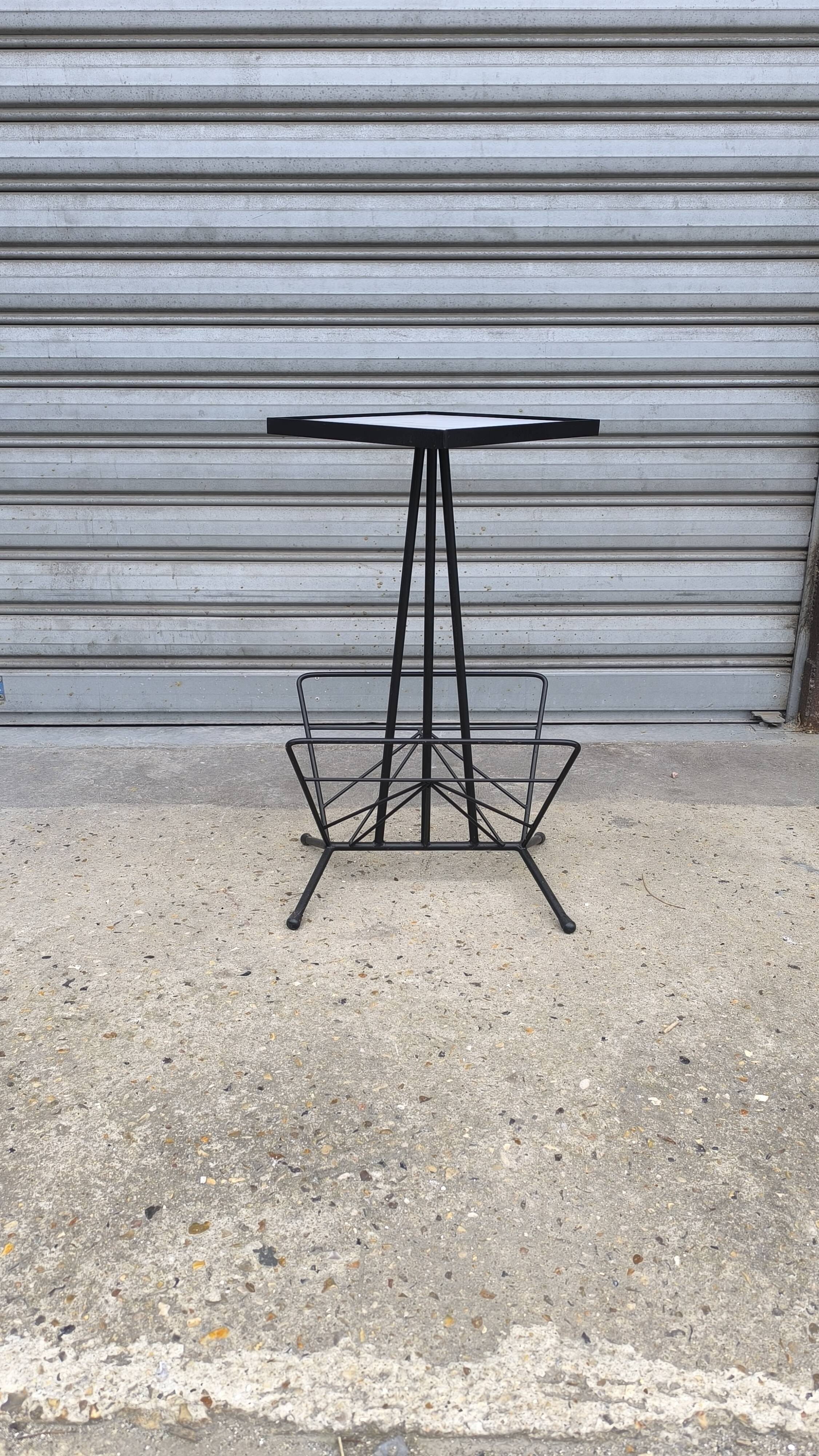 Iron and earthenware magazine rack, 1970