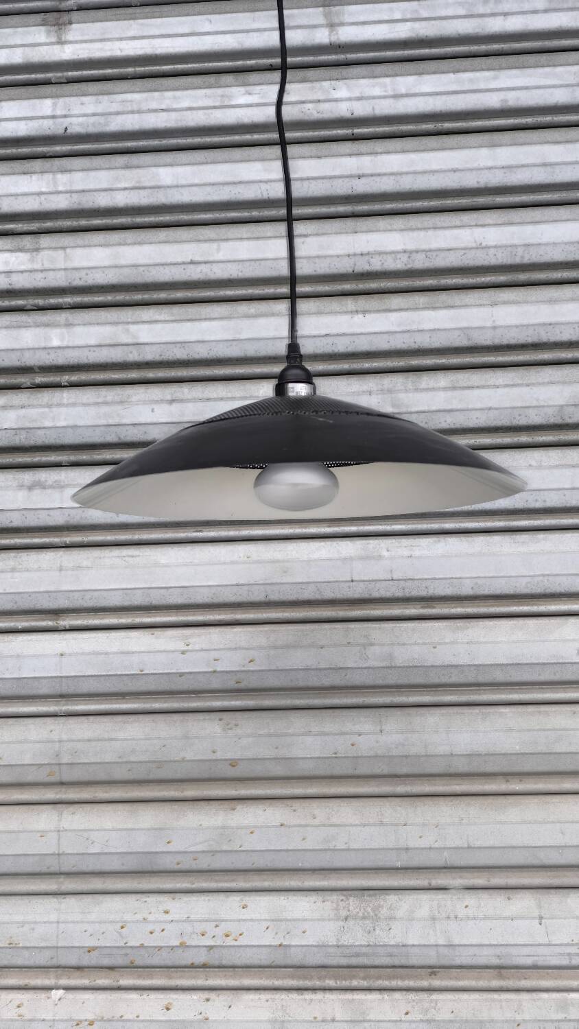 Perforated lacquered sheet metal suspension from the 90s