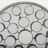 Mirror with round facets design