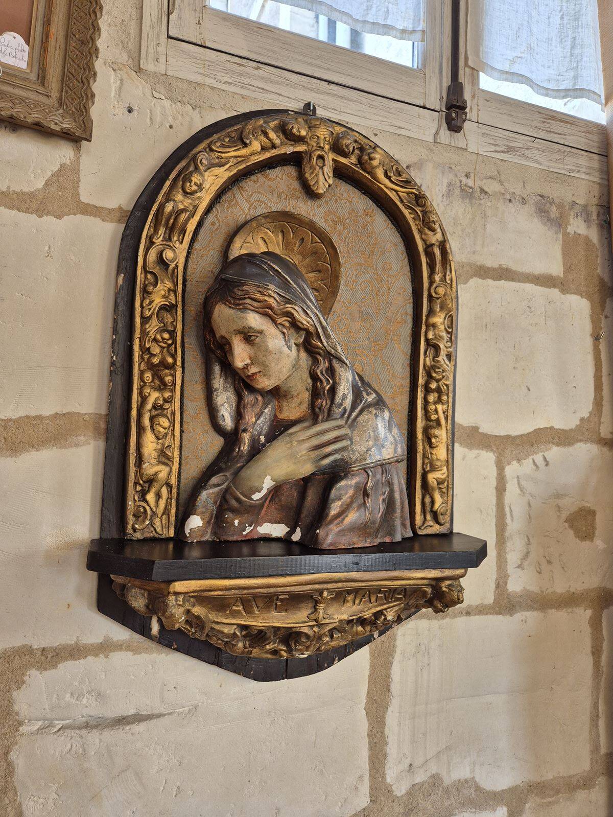 Ancient bas-relief in wood and stucco