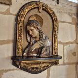 Ancient bas-relief in wood and stucco