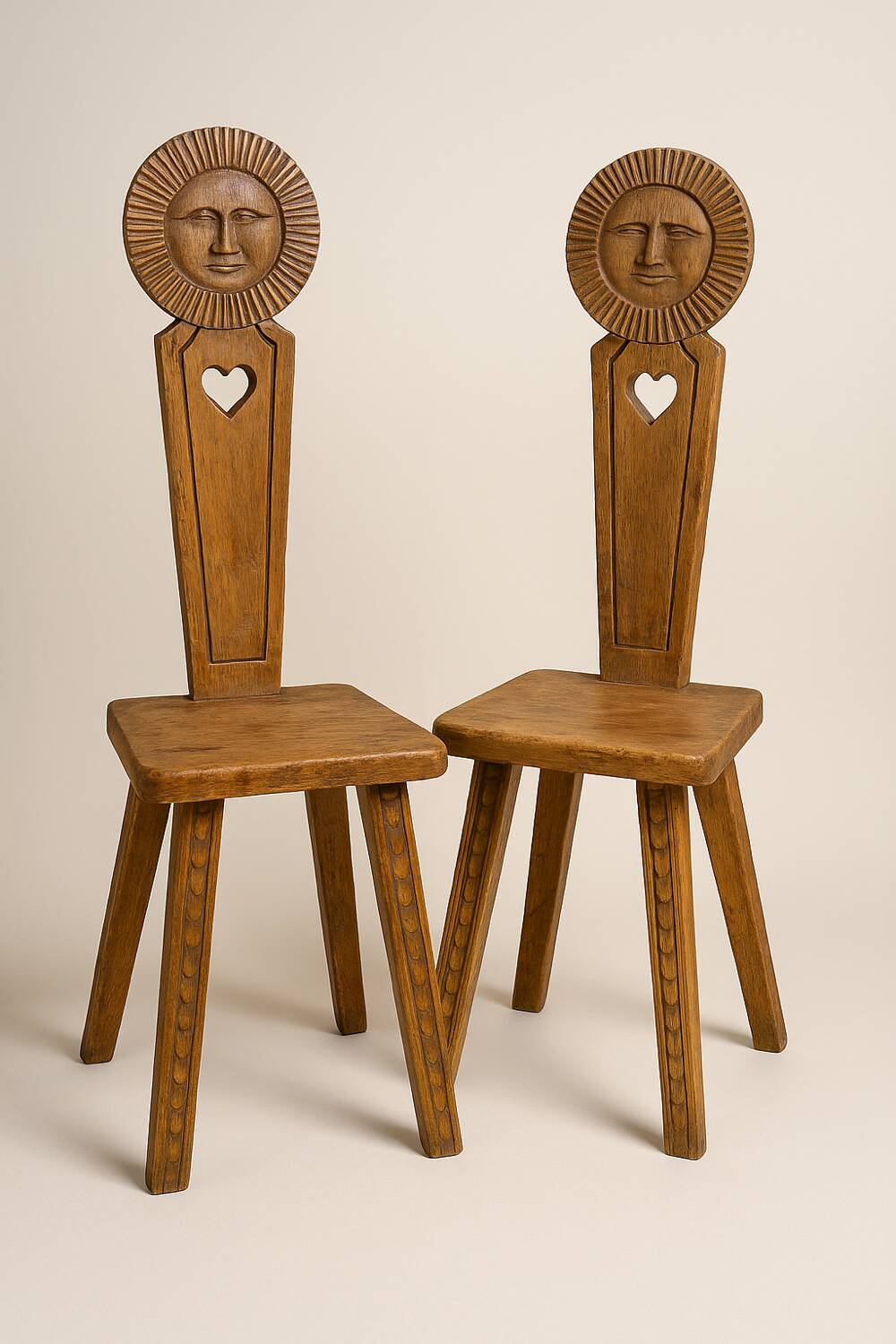 Pair of antique Catalan chairs with sun face motifs, Cerdagne