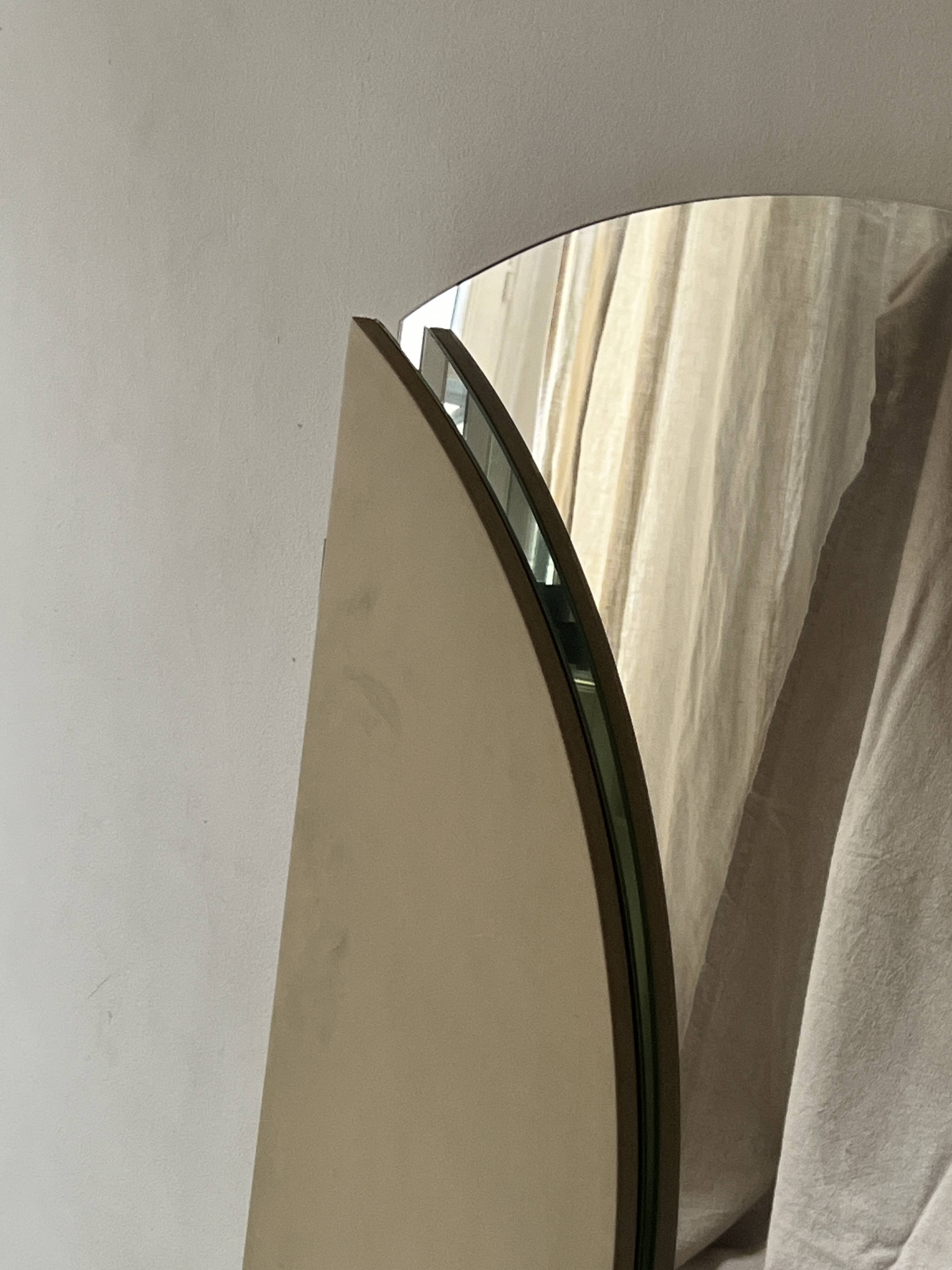 Large round triptych mirror with ivory background and back, 1970s design.