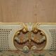 Louis XV window bench embroidered in gold and silver leaf.