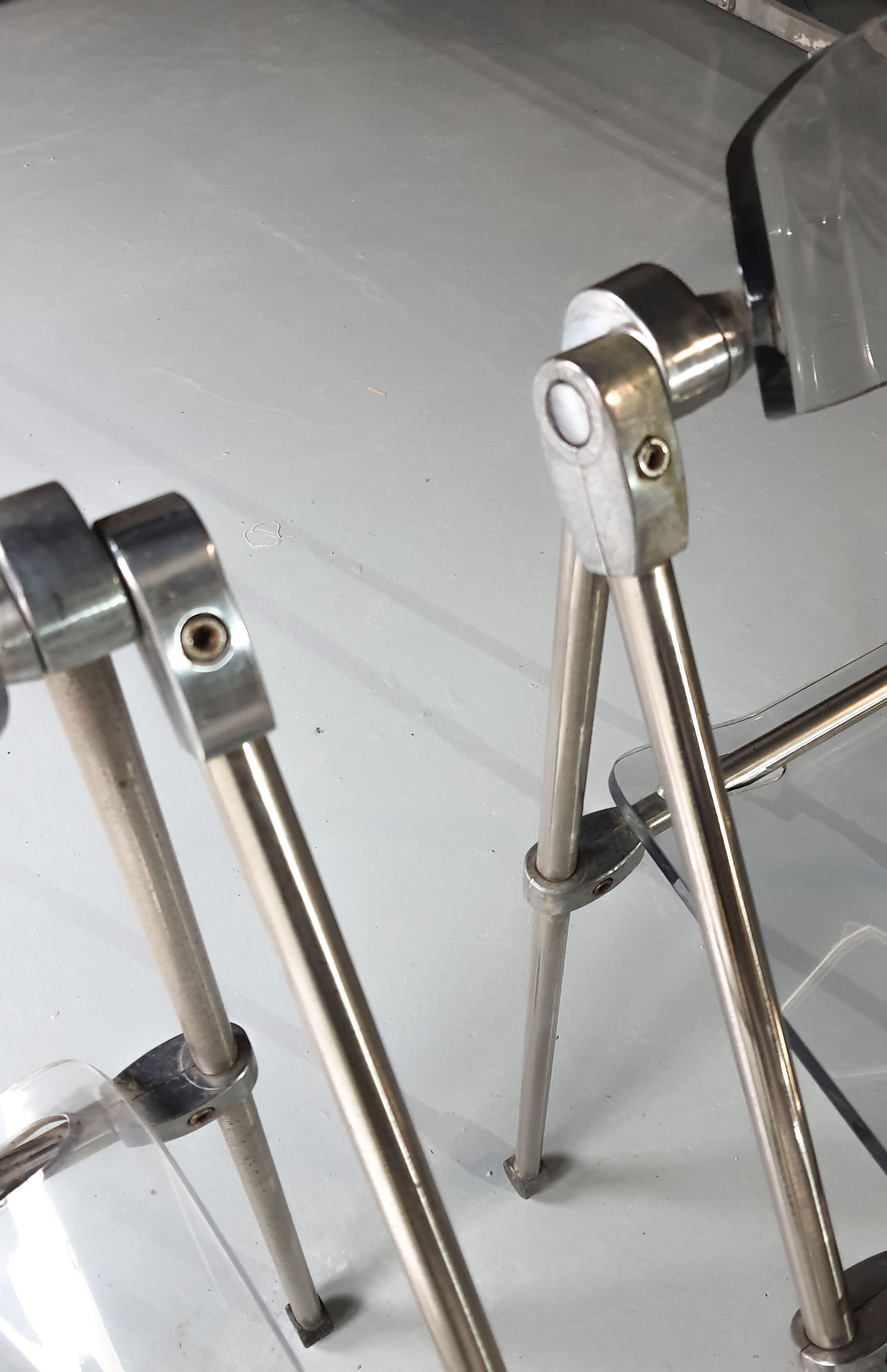 Pair of modern folding chairs in plexiglass