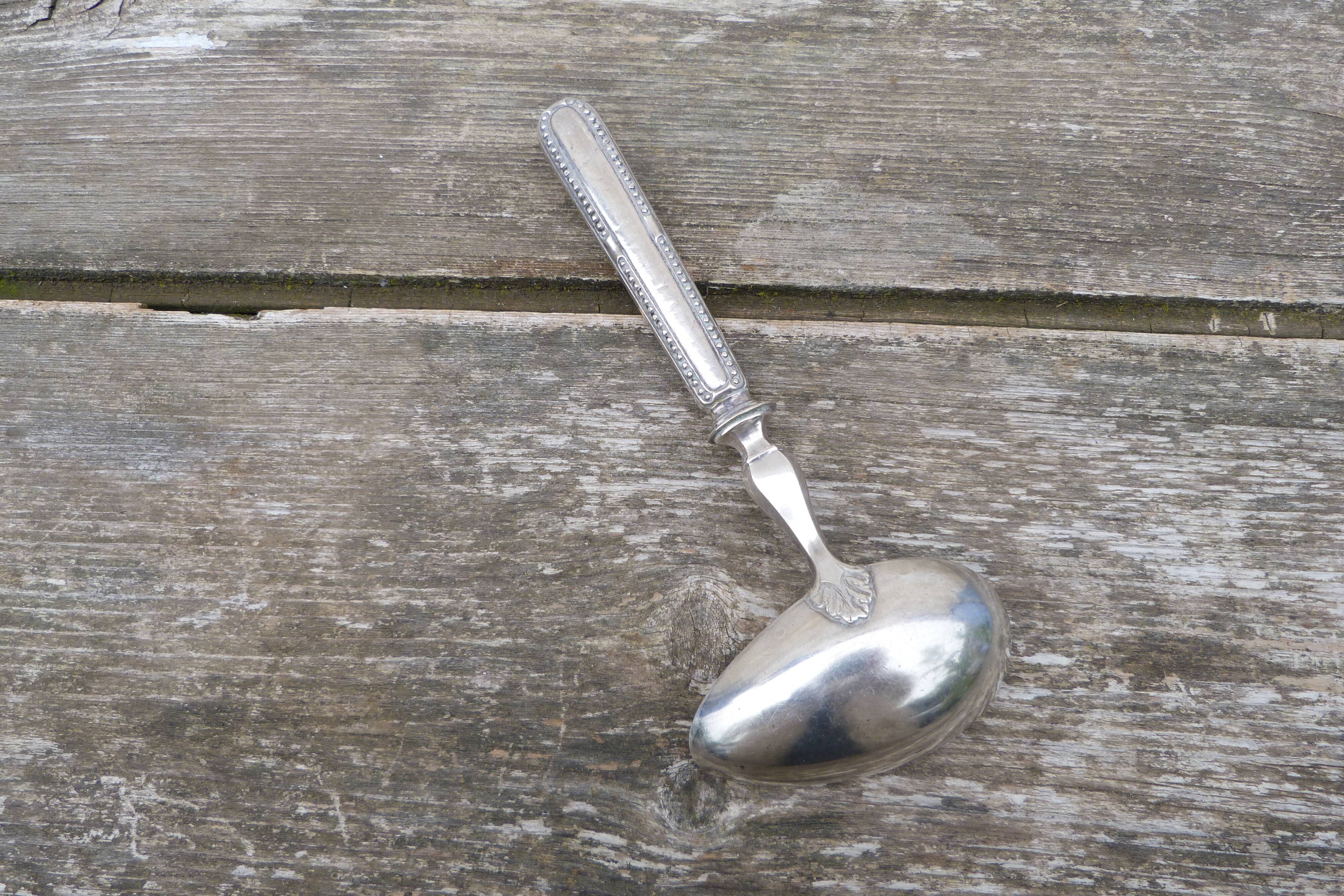 Old sauce spoon