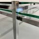 2 large nesting coffee tables in chrome and glass, 1970s design.