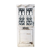 Old door with wrought iron grille