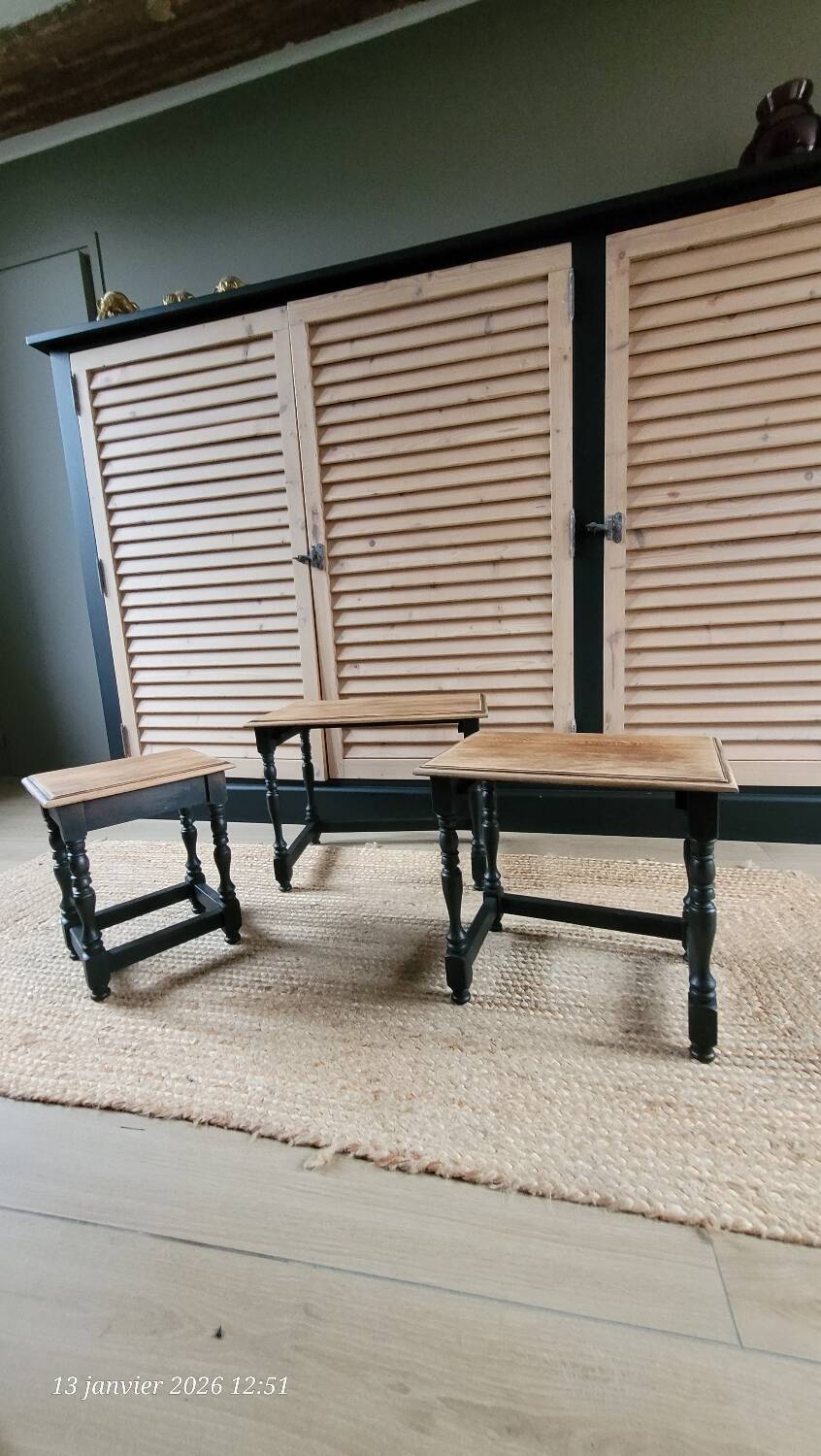 Nest tables in wood and black.