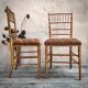 Paire de chaises dorées «faux bambou»